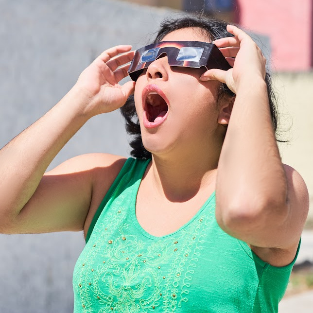 woman with eclipse glasses